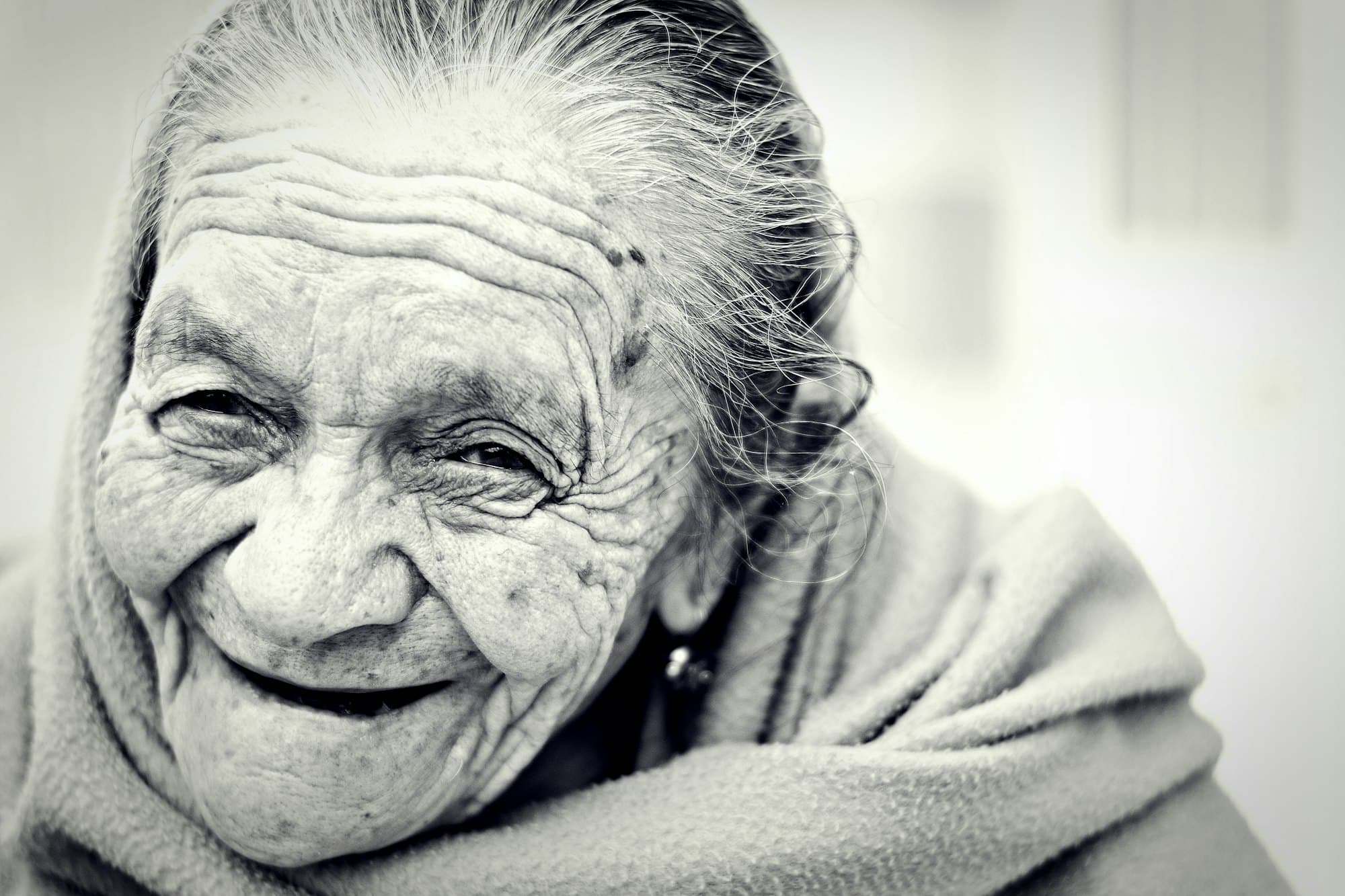 An older woman smiling warmly